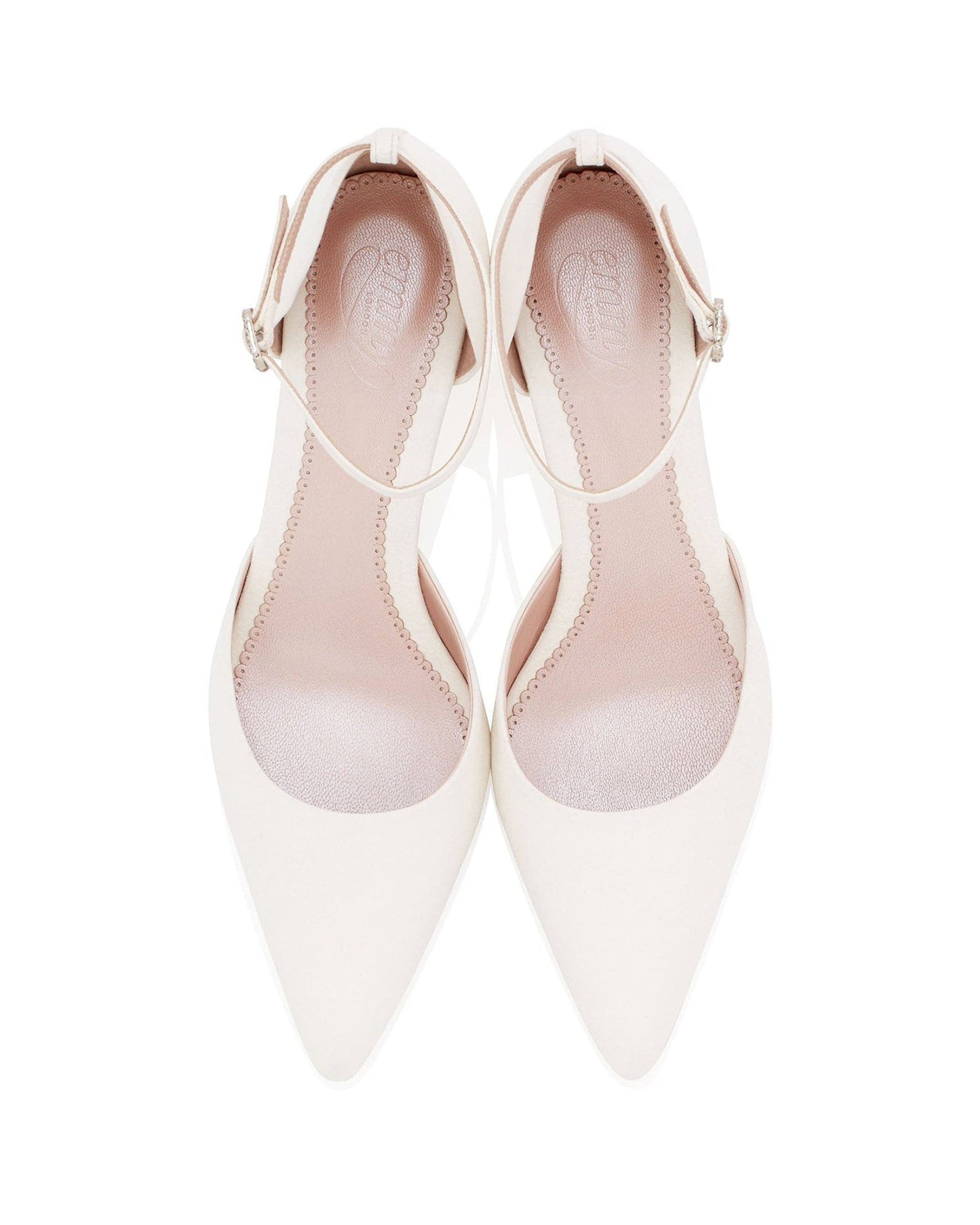 White pointed-toe heels with a delicate ankle strap, featuring a sleek design. The shoes are displayed from a top-down angle against a plain white background, highlighting their elegant silhouette. The interior is softly padded for comfort.